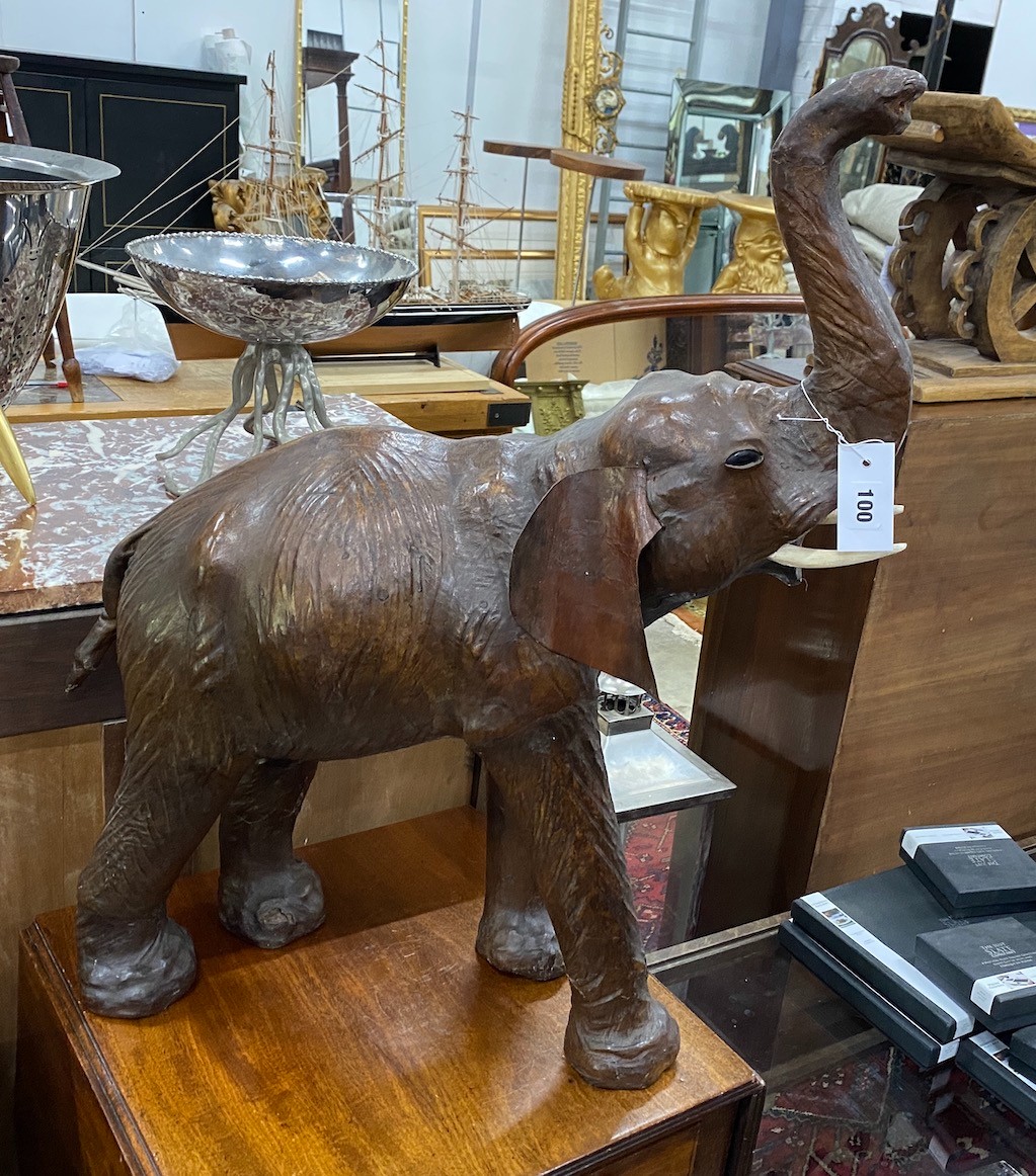 A large leather model of an elephant, height 76cm